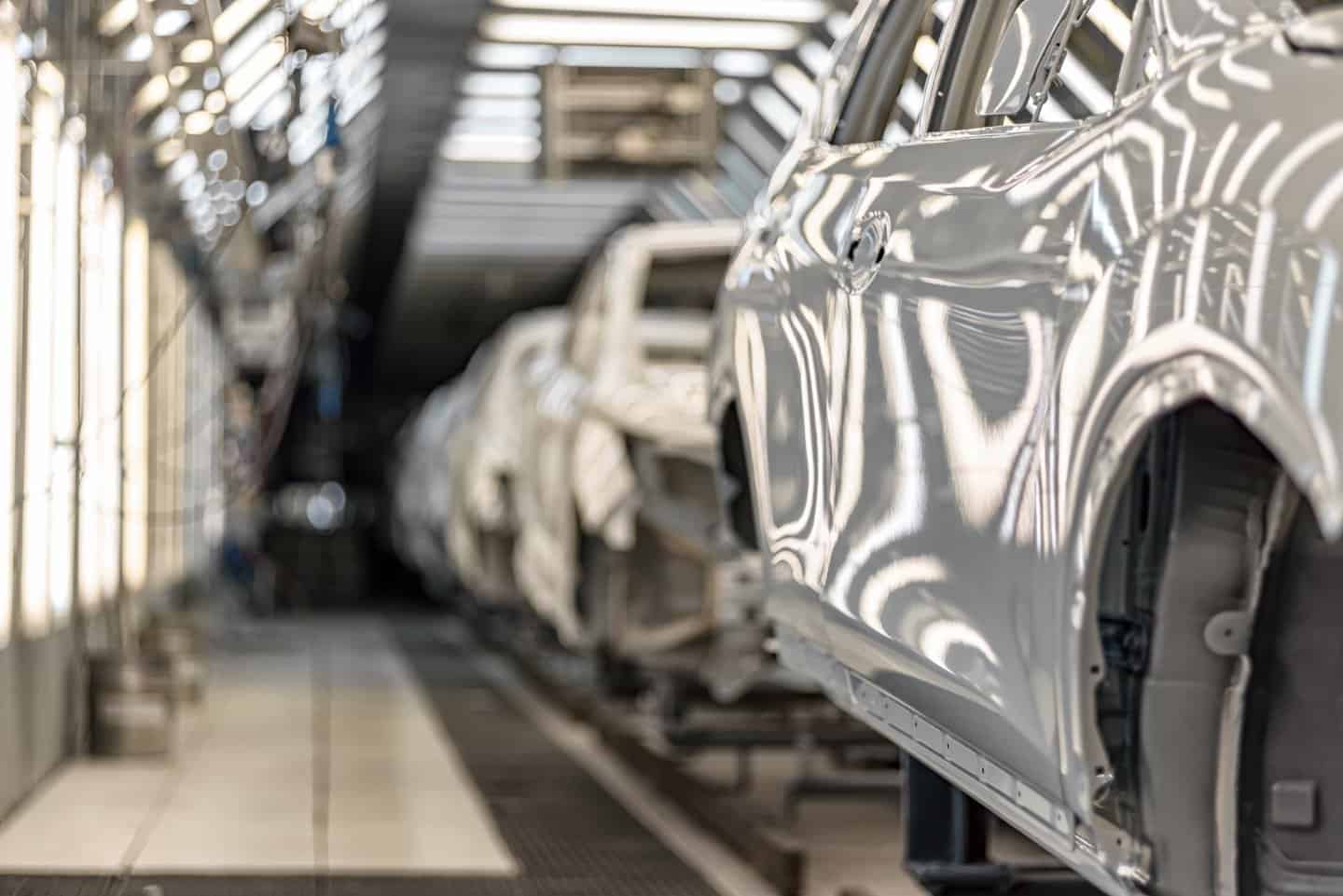 Vehicle bodies moving down an automotive assembly line