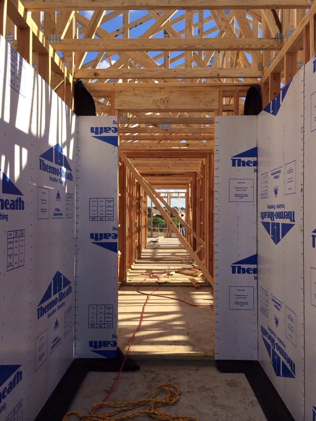 House framing wrapped in exterior sheathing board
